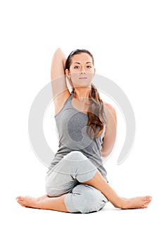 Calm young woman doing yoga