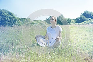 Calm young yoga woman with eyes closed for centered mindfulness photo