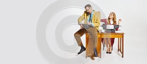 Calming boss during stressful talk. Businessman and woman, personal assistance over grey background. Concept of business