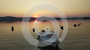 Calming sunset in Dalmatia, Sibenik, orange color and a boat, Adriatic sea, Croatia