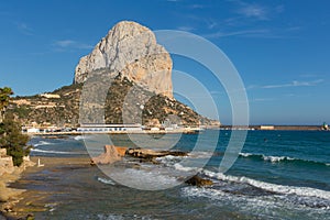 Calp Spain Penon de Ifach with blue sky and waves