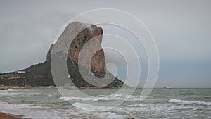 Calpe Rock and Mediterranean Sea. Big sea waves crashing on rocky hill