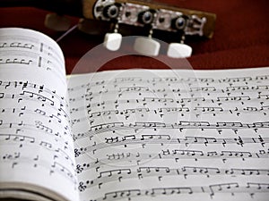 Calssical guitar and partiture book photo