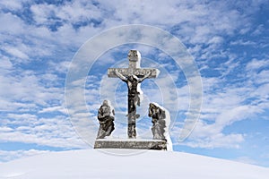 Cross covered with snow - Calvary photo