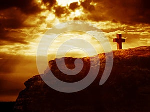 Calvary cross on a rock photo