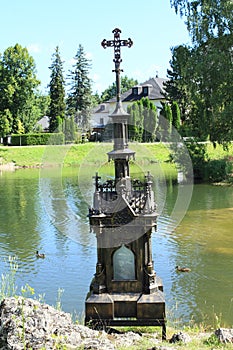 Calvary with pond and Castle Liptovsky Hradok