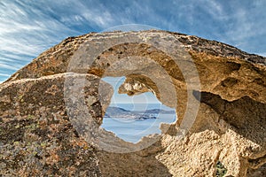 Calvi in Corsica viewed through hole in rock