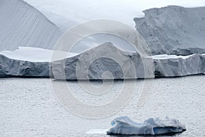 Calving glacier and large icebergs at Paradise Bay, Antarctic Peninsula