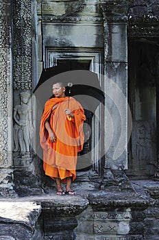 Cambodia Angkor wat gallery with a monk