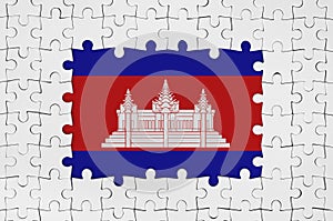 Cambodia flag in frame of white puzzle pieces with missing central part