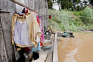 Cambodia, laundry hanging in a house
