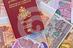 Cambodian passports over Cambodian banknotes in different a Riels