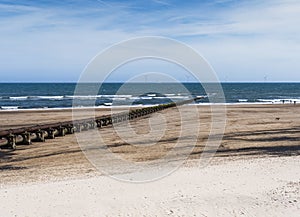 Cambois beach in Northumberland, UK with wind turbines