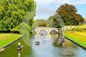 Cambridge, Cambridgeshire, United Kingdom - AUG 28, 2019: Tourists on punt trip along River Cam near Kings College in the city of