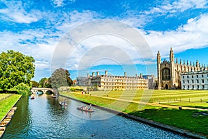 Cambridge, Cambridgeshire, United Kingdom - AUG 28, 2019: Tourists on punt trip along River Cam near Kings College in the city of