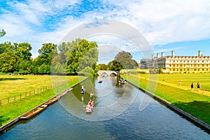 Cambridge, Cambridgeshire, United Kingdom - AUG 28, 2019: Tourists on punt trip along River Cam near Kings College in the city of