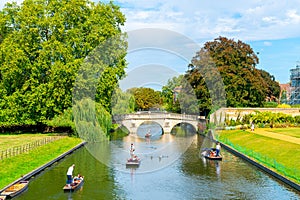 Cambridge, Cambridgeshire, United Kingdom - AUG 28, 2019: Tourists on punt trip along River Cam near Kings College in the city of