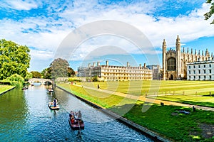 Cambridge, Cambridgeshire, United Kingdom - AUG 28, 2019: Tourists on punt trip along River Cam near Kings College in the city of