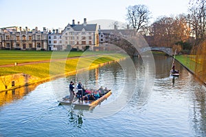 Cambridge, River Cam and tourist's boats at sunset