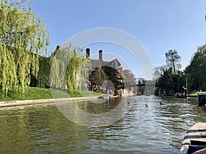 Cambridge, UK - April 20, 2019: View of Jerwood library and the orgasm bridge crossing the river Cam on a sunny day