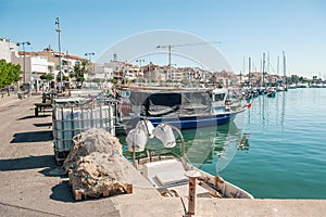 Cambrils Spain-August 8 2013. Boats and fishing nets and tackle lie in wait for fishing. Small business Europe. Tourist places of