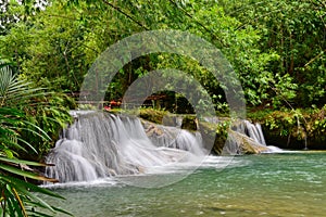 Cambugahay Falls, a 3-tiered waterfall popular for swimming on Siquijor Island in Philippines