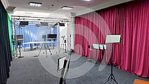 Camcorder in the background in the film studio. Type of photo studio. VideoBlog recording, media production. Video filming in the