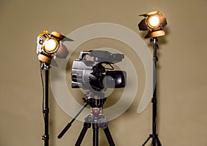 Camcorder and the two spotlights with Fresnel lenses