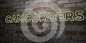 CAMCORDERS - Glowing Neon Sign on stonework wall - 3D rendered royalty free stock illustration