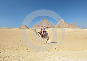 Camel ride by Giza pyramids