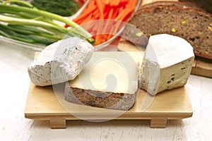 Camembert and brie on plate