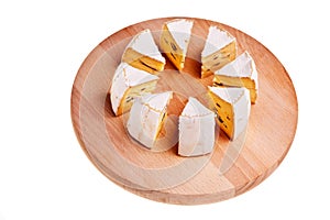 Camembert cheese cut into radial sections.