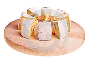 Camembert cheese cut into radial sections.