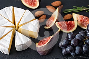 Camembert cheese with figs and grapes