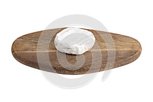 Camembert on a white background. Camembert cheese on a board close-up on a white background