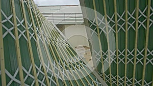 Camera Approaches Building Entrance with Fallen Fence