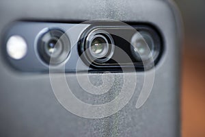 The camera on cell phone. Smartphone camera close-up. Close up of a mobile phone camera, flash and sensors
