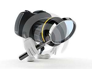 Camera character looking through magnifying glass