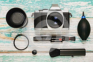 Camera with cleaning kit, flat lay