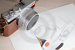 Camera on desk with illustration of camera