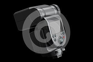 Camera external flash speedlight isolated on black background.