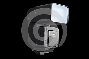 Camera external flash speedlight isolated on black background.