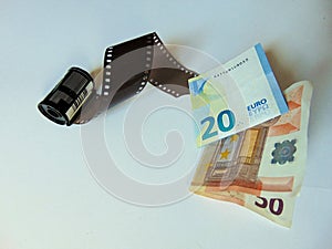 Camera film turning into money | stockphotography concept