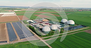 Camera flight over biogas plant from pig farm. Renewable energy from biomass. Modern agriculture European Union. aerial
