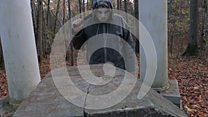 Camera focusing on man in scary Halloween mask