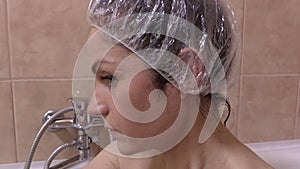 Camera focusing on woman who washing hand in bath