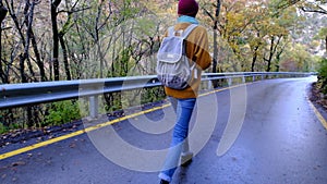 Camera follows hipster woman on trip or adventure.