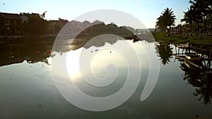 Camera follows sun disk reflection on river water