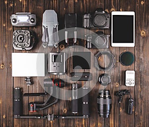 Camera gear on wood top view