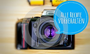 Camera with in german Alle Rechte vorbehalten in english All rights reserved